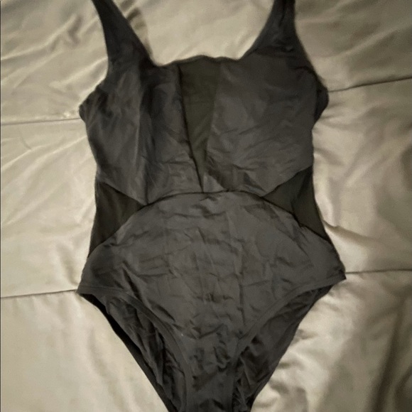 Black one piece swimsuit with some see through mesh - Picture 1 of 2
